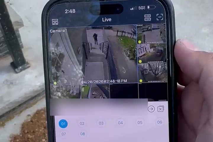 Live security camera feed being viewed on a phone